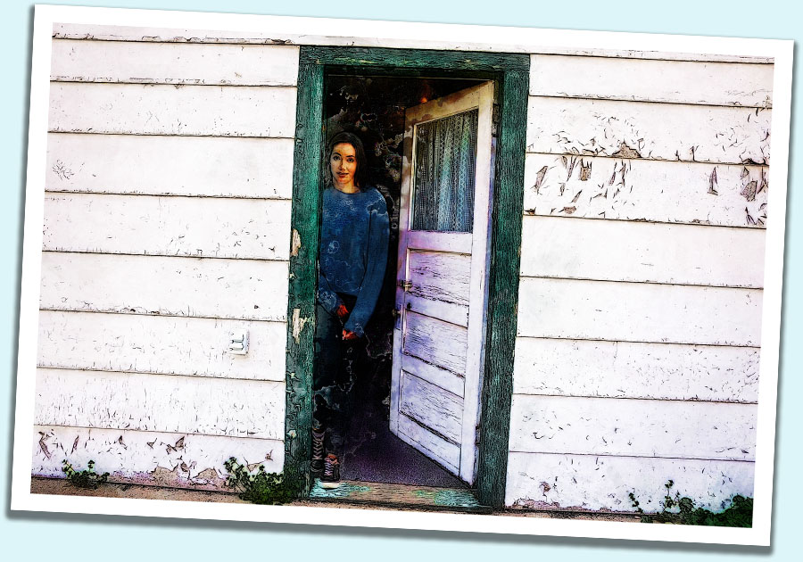 Woman at door in Old Wounds, New Spears
